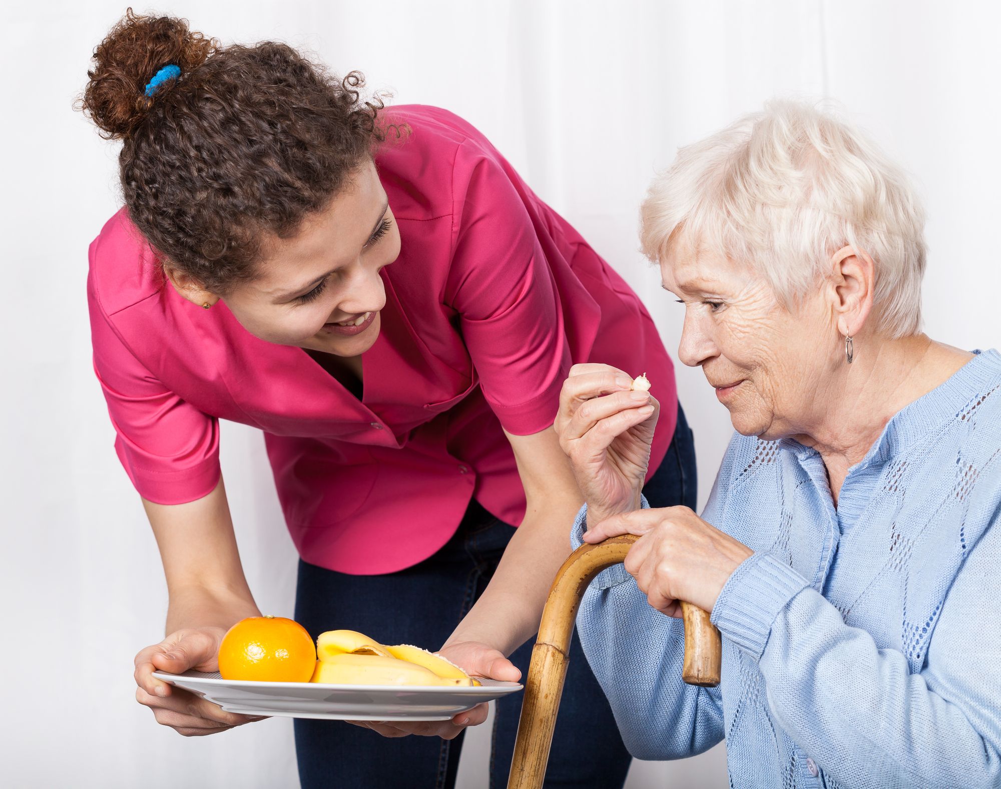 CG giving food to female with cane (1).jpg