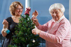iStock-123466783_elderly-woman-adult-daughter-decorating-Christmas-tree-300x200.jpg