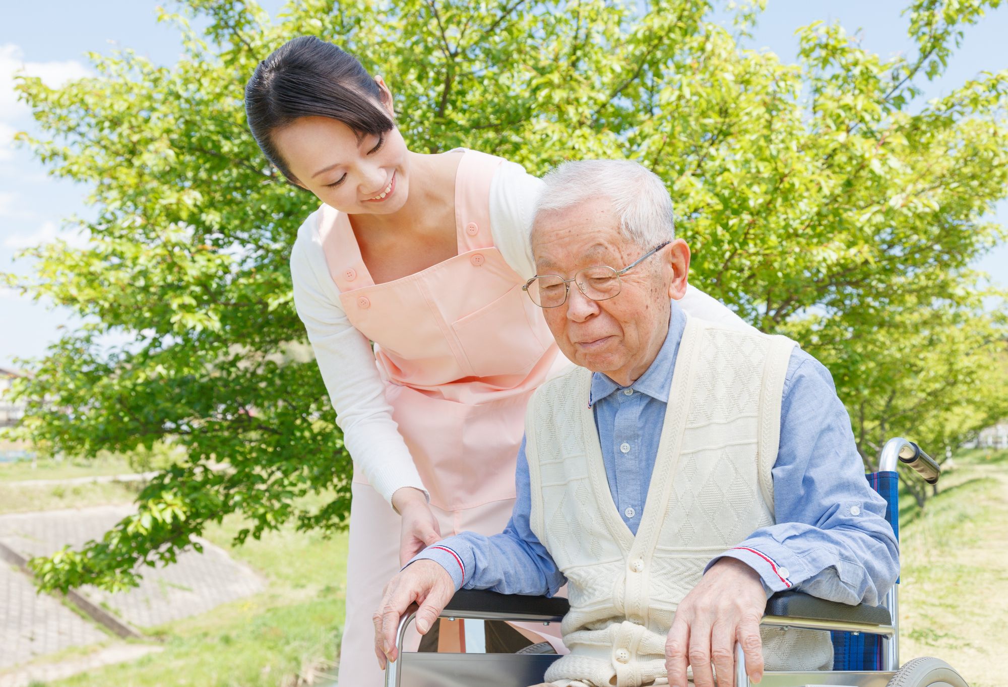 female CG with male client in wheelchair outside_2 (1).jpg
