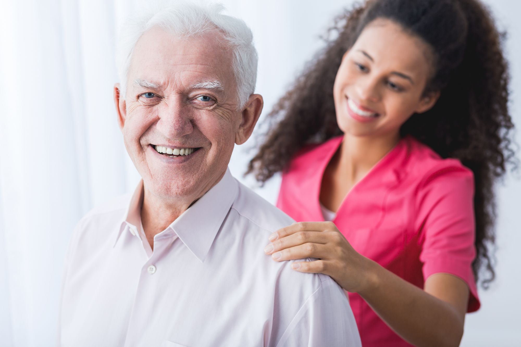 female CG hand on male client shoulder from behind.jpg