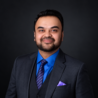 Polished Corporate Portrait in Charcoal Suit.png