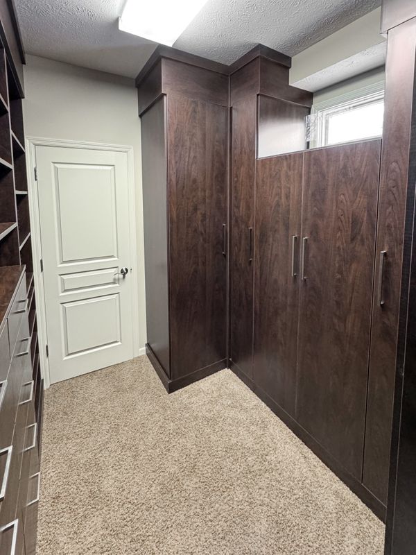 Walk-In Closet with Dark Wood Cabinets, Omaha