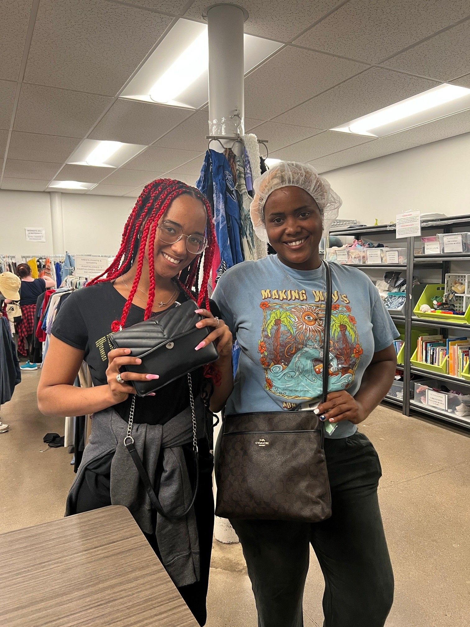 sisters picking up purses.jpg