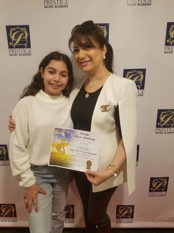 Piano instructor Naira with one of her students