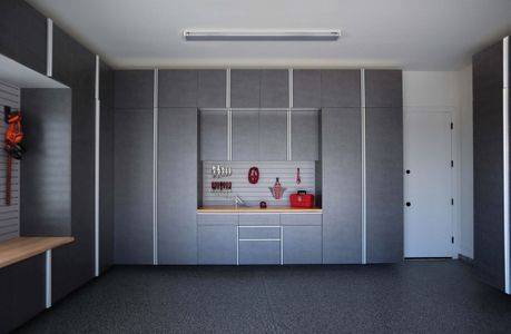 pewter-cabinets-with-butcher-block-countertop-and-grey-slatwall.jpg