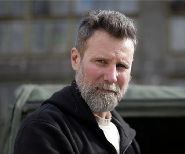 Portrait of a bearded man in a dark jacket