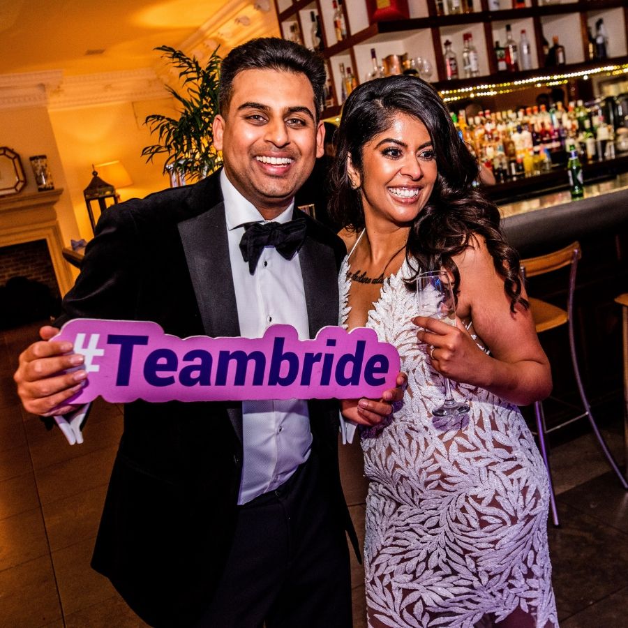 Bride and Groom with Team Bride Sign - Roamer Photo Booth