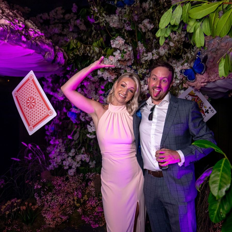 Couple Posing in Themed Photo Booth