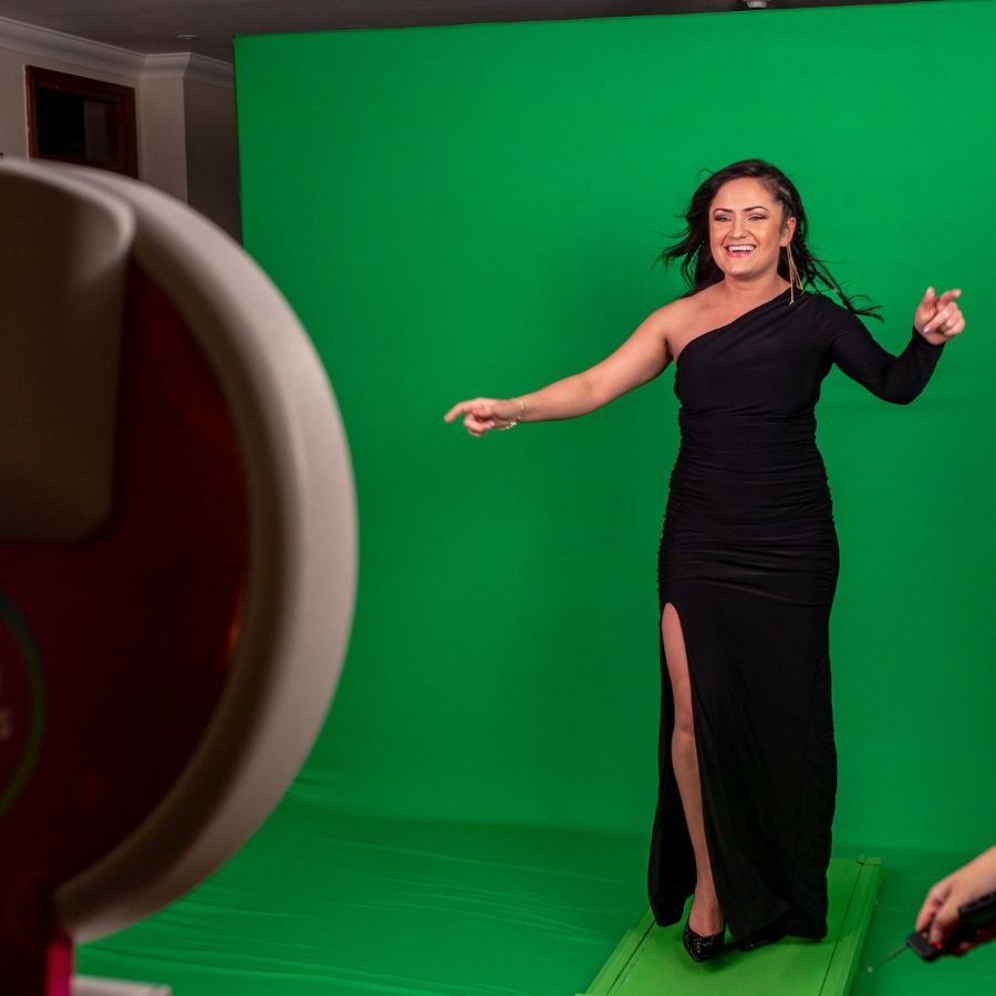 Smiling Woman in Black Dress at Green Screen Photo Booth - Green Screen Photo Booth AZ