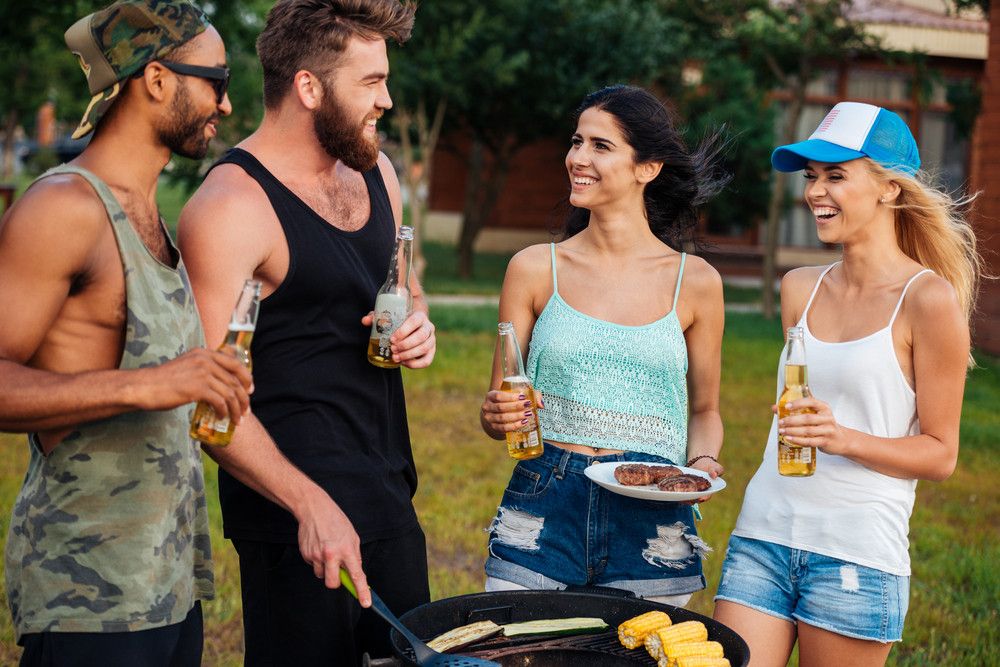 graphicstock-group-of-happy-young-people-with-beer-standing-and-frying-vegetables-on-barbeque-grill-outdoors_rulJlIES2x_PMNW.jpg